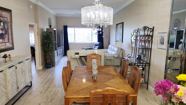 9587 Weldon Cir Unit B414, Tamarac, FL 33321 - dining room with light wood-style flooring, crown molding, a chandelier, and baseboards