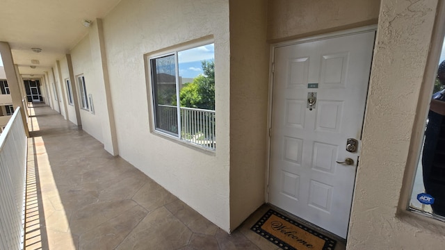 9587 Weldon Cir Unit B414, Tamarac, FL 33321 - view of exterior entry with stucco siding