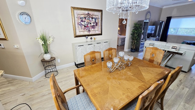 9587 Weldon Cir Unit B414, Tamarac, FL 33321 - dining space with a chandelier, light wood-style floors, ornamental molding, and baseboards