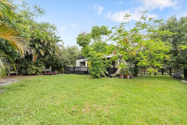 1117 Gopher Ridge Rd, Fort Pierce, FL 34982 - view of grassy yard with a wooden deck
