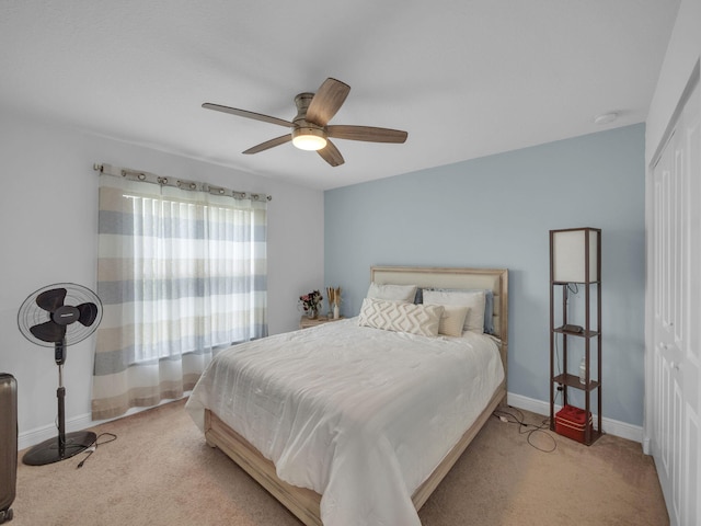 16430 71st Ln N, Loxahatchee, FL 33470 - bedroom with carpet floors, a closet, baseboards, and a ceiling fan