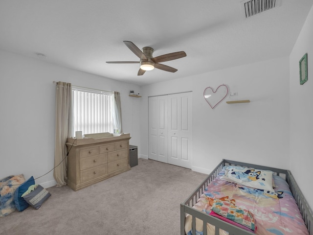 16430 71st Ln N, Loxahatchee, FL 33470 - bedroom featuring a closet, light colored carpet, a ceiling fan, and baseboards