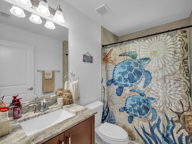 16430 71st Ln N, Loxahatchee, FL 33470 - full bathroom with vanity, toilet, and curtained shower