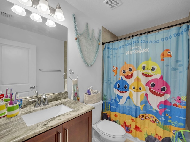 16430 71st Ln N, Loxahatchee, FL 33470 - bathroom with vanity, toilet, and a shower with curtain