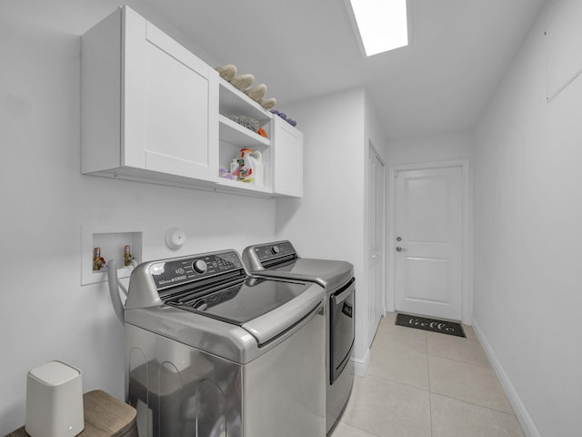 16430 71st Ln N, Loxahatchee, FL 33470 - laundry room with cabinet space, independent washer and dryer, light tile patterned floors, and baseboards