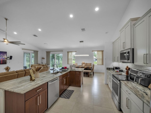 16430 71st Ln N, Loxahatchee, FL 33470 - kitchen with appliances with stainless steel finishes, a sink, lofted ceiling, open floor plan, and a ceiling fan