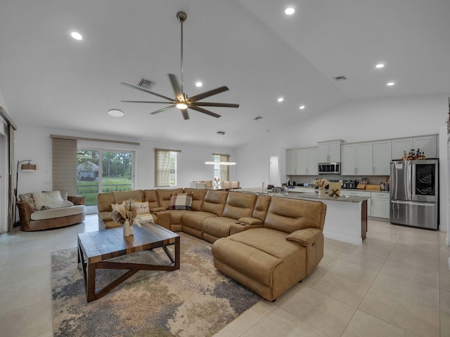 16430 71st Ln N, Loxahatchee, FL 33470 - living area with vaulted ceiling, light tile patterned floors, a ceiling fan, and recessed lighting
