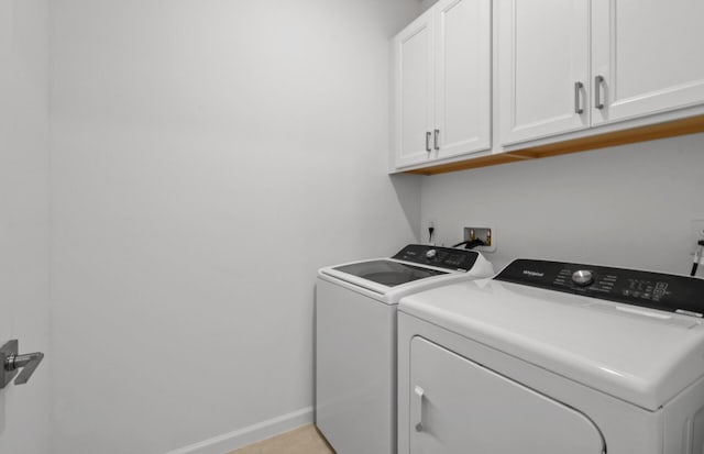 1223 Harper Way Unit 9, Vero Beach, FL 32960 - laundry area with cabinet space and washing machine and clothes dryer