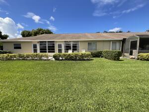 18856 Argosy Dr Unit C, Boca Raton, FL 33496 - ranch-style house with a front lawn