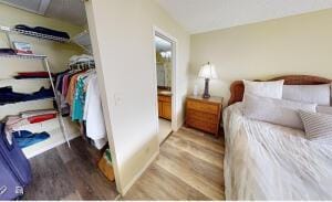 18856 Argosy Dr Unit C, Boca Raton, FL 33496 - bedroom featuring wood finished floors and connected bathroom