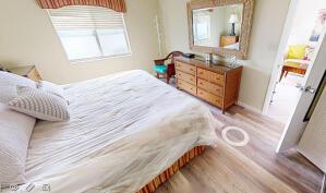 18856 Argosy Dr Unit C, Boca Raton, FL 33496 - bedroom featuring wood finished floors and baseboards