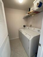 18856 Argosy Dr Unit C, Boca Raton, FL 33496 - laundry room featuring washer / clothes dryer and light tile patterned floors