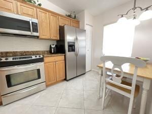 18856 Argosy Dr Unit C, Boca Raton, FL 33496 - kitchen with appliances with stainless steel finishes, light tile patterned floors, and dark countertops