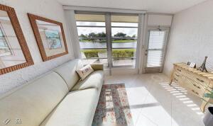 18856 Argosy Dr Unit C, Boca Raton, FL 33496 - living area featuring a water view