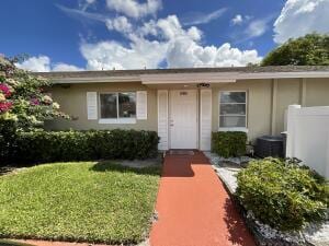 18856 Argosy Dr Unit C, Boca Raton, FL 33496 - doorway to property with a yard and stucco siding