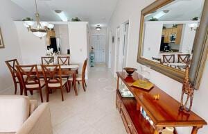 18856 Argosy Dr Unit C, Boca Raton, FL 33496 - dining area featuring a chandelier
