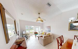 18856 Argosy Dr Unit C, Boca Raton, FL 33496 - living room featuring plenty of natural light, a ceiling fan, and lofted ceiling
