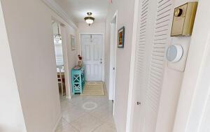 18856 Argosy Dr Unit C, Boca Raton, FL 33496 - hall with light tile patterned flooring and baseboards