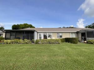 18856 Argosy Dr Unit C, Boca Raton, FL 33496 - view of front of home with a sunroom and a front lawn