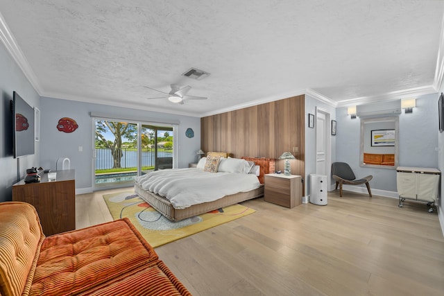 2407 SW 23rd Cranbrook Dr, Boynton Beach, FL 33436 - bedroom featuring access to outside, crown molding, light wood-style floors, wooden walls, and a ceiling fan