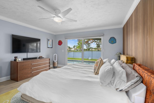 2407 SW 23rd Cranbrook Dr, Boynton Beach, FL 33436 - bedroom with access to exterior, light wood-style flooring, ornamental molding, a textured ceiling, and baseboards