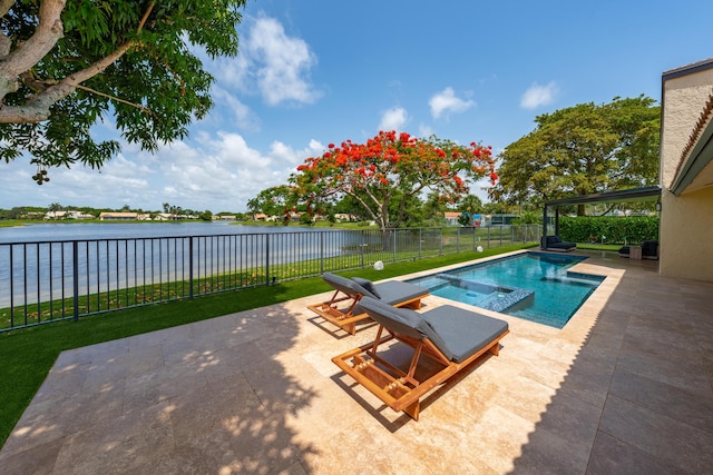 2407 SW 23rd Cranbrook Dr, Boynton Beach, FL 33436 - view of pool with a water view, a patio, a fenced backyard, and a pool with connected hot tub