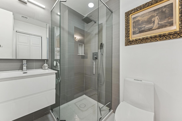 13725 Flora Pl Unit D, Delray Beach, FL 33484 - bathroom featuring toilet, vanity, and a stall shower