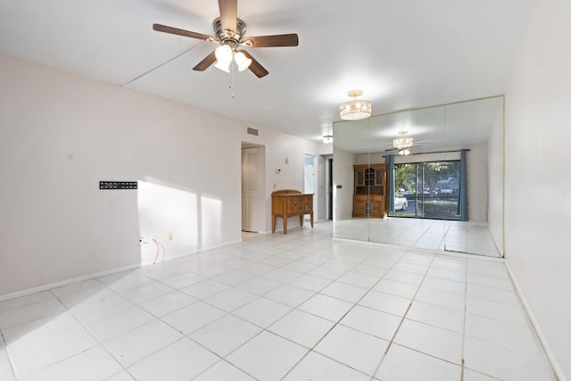 800 NW Fork Rd Unit 9-1, Stuart, FL 34994 - spare room featuring ceiling fan, light tile patterned flooring, and baseboards