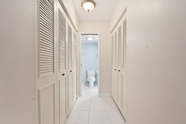 800 NW Fork Rd Unit 9-1, Stuart, FL 34994 - hallway with light tile patterned flooring