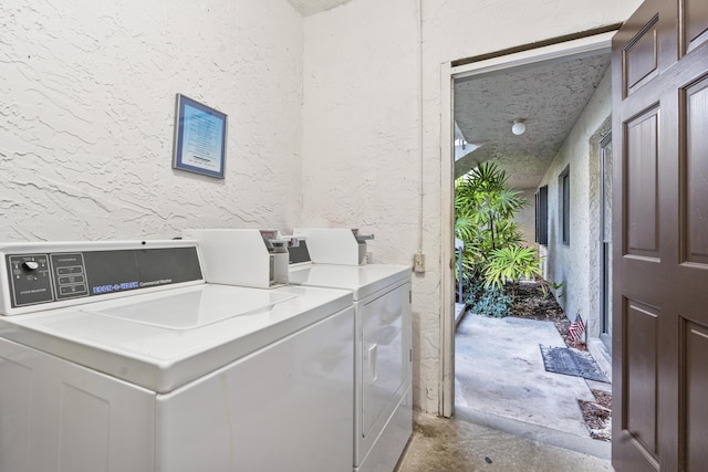 800 NW Fork Rd Unit 9-1, Stuart, FL 34994 - shared laundry featuring a textured wall and separate washer and dryer