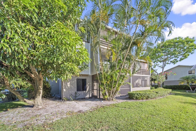 800 NW Fork Rd Unit 9-1, Stuart, FL 34994 - back of property with a lawn and stucco siding