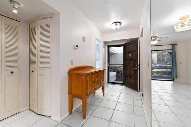 800 NW Fork Rd Unit 9-1, Stuart, FL 34994 - entrance foyer with light tile patterned floors, baseboards, and ceiling fan
