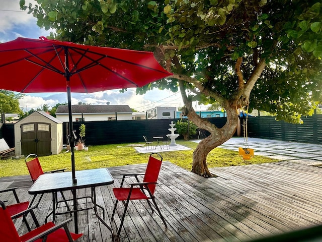 5690 Honeysuckle Dr, West Palm Beach, FL 33415 - wooden terrace featuring outdoor dining area