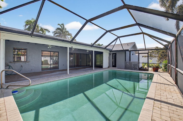 17315 Lake Park Rd, Boca Raton, FL 33487 - swimming pool with ceiling fan, a patio area, and a lanai