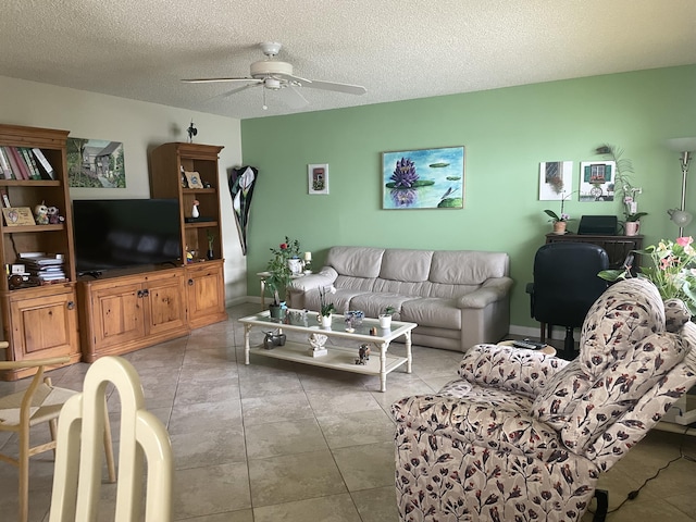 173 Normandy D, Delray Beach, FL 33484 - living room featuring a ceiling fan and a textured ceiling