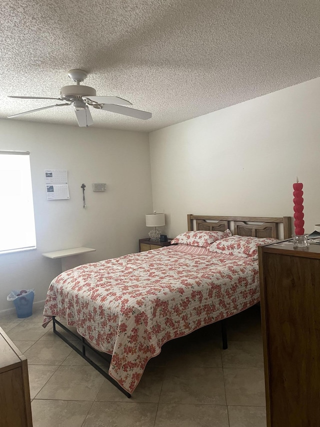 173 Normandy D, Delray Beach, FL 33484 - bedroom with light tile patterned floors, a ceiling fan, and a textured ceiling