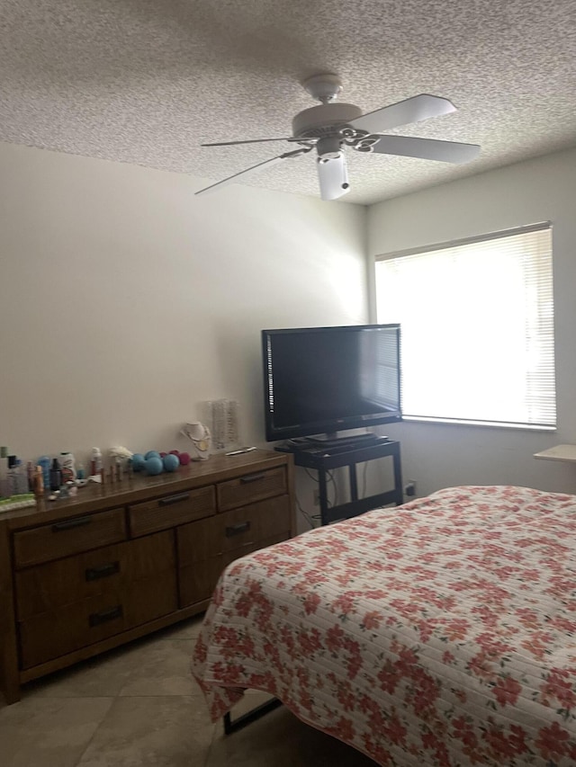 173 Normandy D, Delray Beach, FL 33484 - bedroom with a textured ceiling, light tile patterned floors, and ceiling fan