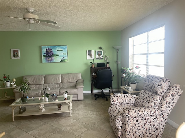 173 Normandy D, Delray Beach, FL 33484 - tiled living room featuring a desk, a ceiling fan, and a textured ceiling