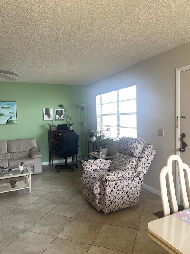 173 Normandy D, Delray Beach, FL 33484 - living area with a textured ceiling, a desk, and tile patterned flooring