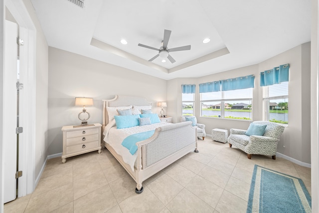 11187 SW Lake Park Dr, Port Saint Lucie, FL 34987 - bedroom with baseboards, a raised ceiling, recessed lighting, light tile patterned floors, and ceiling fan