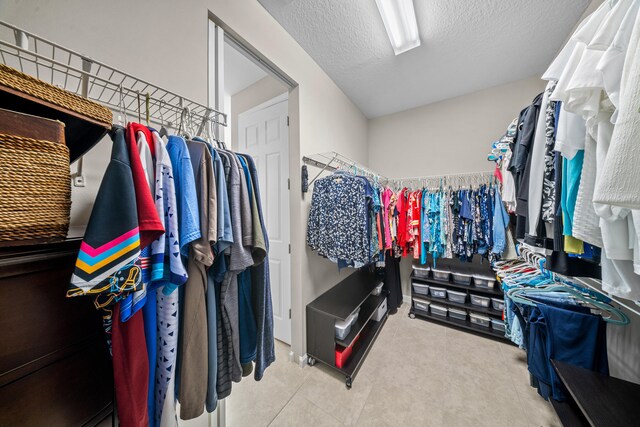 11187 SW Lake Park Dr, Port Saint Lucie, FL 34987 - spacious closet with tile patterned flooring