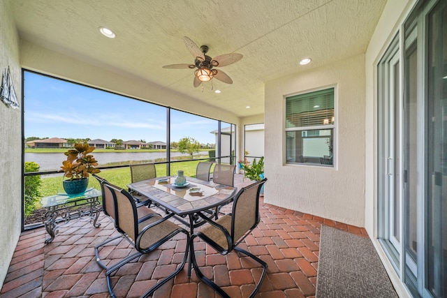 11187 SW Lake Park Dr, Port Saint Lucie, FL 34987 - sunroom featuring a ceiling fan, a water view, and outdoor dining area
