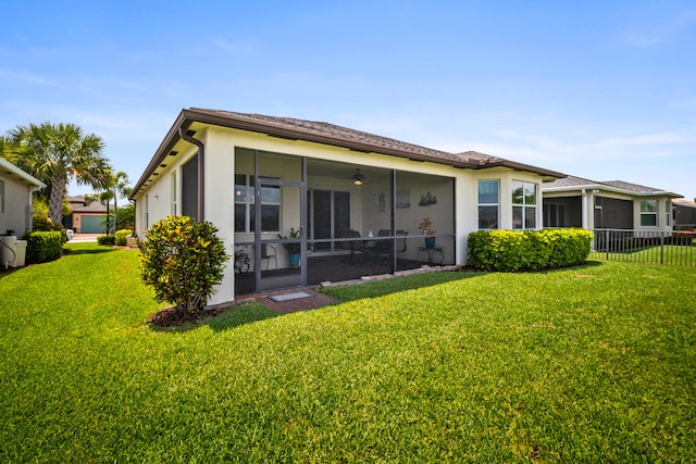 11187 SW Lake Park Dr, Port Saint Lucie, FL 34987 - back of property with a sunroom and stucco siding