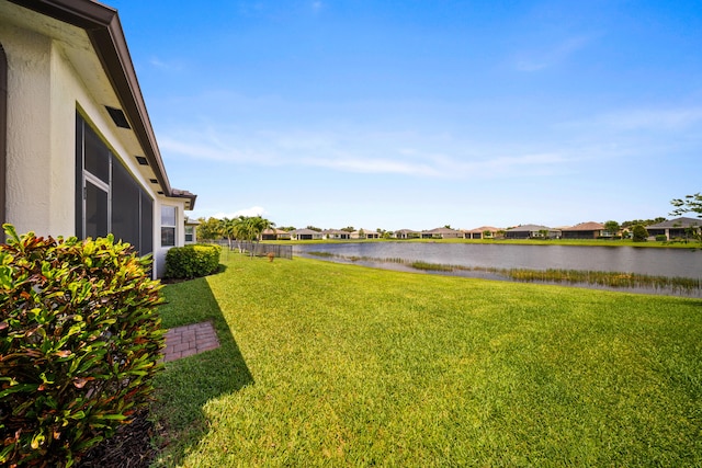 11187 SW Lake Park Dr, Port Saint Lucie, FL 34987 - view of green lawn with a water view and a residential view