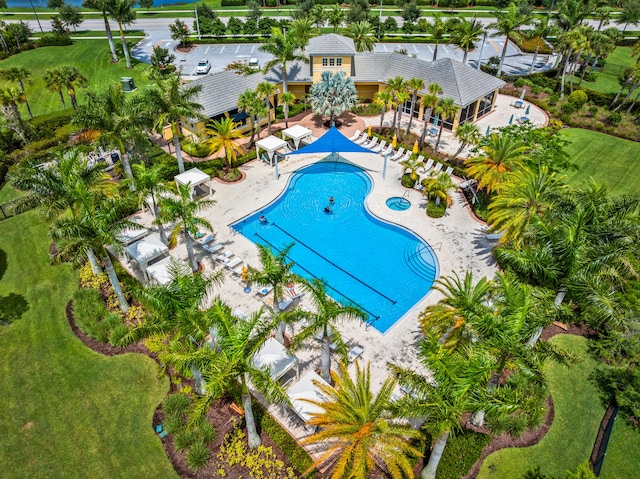 11187 SW Lake Park Dr, Port Saint Lucie, FL 34987 - community pool featuring a patio area