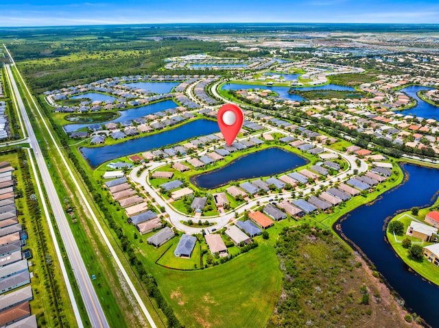11187 SW Lake Park Dr, Port Saint Lucie, FL 34987 - aerial view of residential area featuring a large body of water