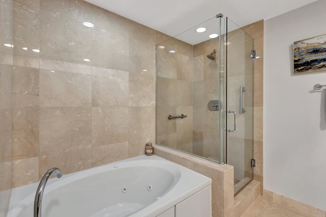 550 Okeechobee Blvd Unit 504, West Palm Beach, FL 33401 - bathroom with a shower stall, a tub with jets, and tile patterned floors