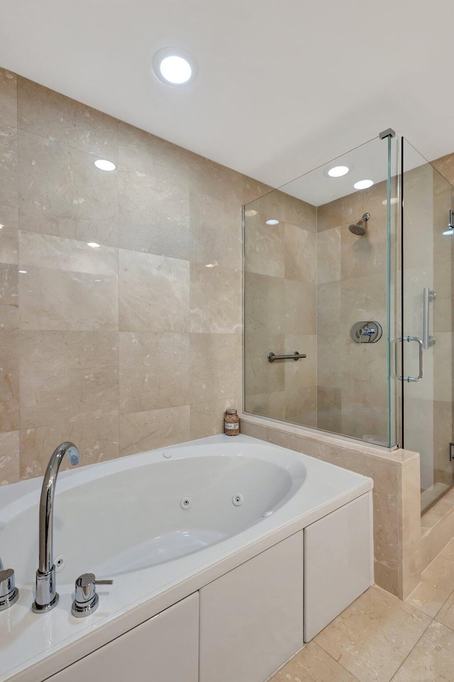 550 Okeechobee Blvd Unit 504, West Palm Beach, FL 33401 - full bathroom featuring a shower stall, a whirlpool tub, and recessed lighting