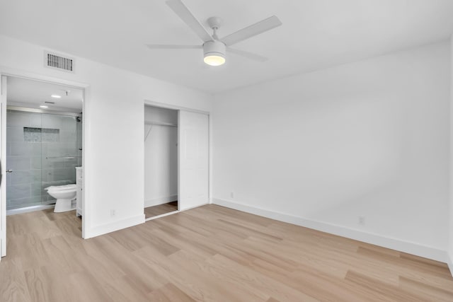 7076 Huntington Ln Unit 206, Delray Beach, FL 33446 - unfurnished bedroom with light wood finished floors, a closet, ensuite bathroom, and ceiling fan
