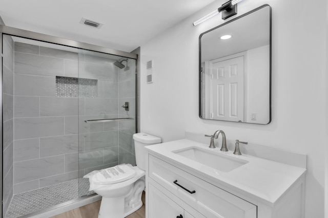 7076 Huntington Ln Unit 206, Delray Beach, FL 33446 - bathroom with a stall shower, vanity, and wood finished floors